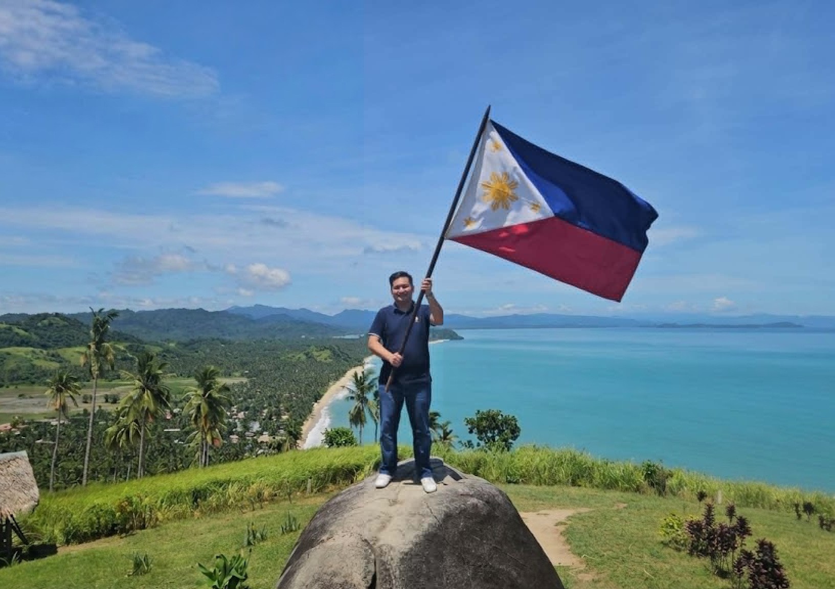Philippine Independence Day — Kiwanis member raising the flag at a scenic Luzon viewpoint